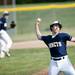 Saline junior pitcher Bryan Homberg throws to first for an out during a double header against Pioneer on Monday, May 20. Daniel Brenner I AnnArbor.com